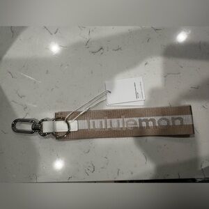 [NWT] Rare Lululemon Never Lost Keychain - TAN